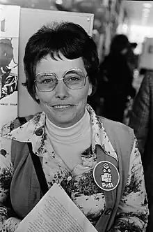 Black and white photograph of van Den Heuvel, wearing a badge of the PvdA