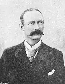 Black and white photograph of man with moustache