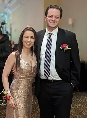 Image of Jeff Lehman and Carolina Belmares, standing, smiling, wearing gala attire