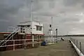 Gorey Harbour, looking south from the pier across the Royal Bay of Grouville towards La Rocque