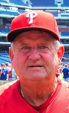 A man in a red shirt and cap