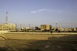 The reservoir and a Mamluk-era building in al-Jizah