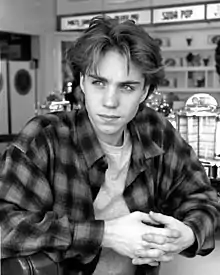 Image 91Jonathan Brandis in a Grunge-style flannel shirt and curtained hair in 1993 (from 1990s in fashion)