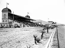 B&W photo of a race track grandstand