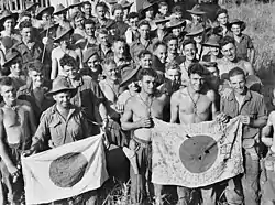 Image 5Australian soldiers display Japanese flags they captured at Kaiapit, New Guinea in 1943 (from History of the Australian Army)