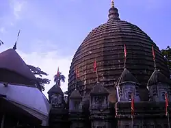 The shikhara made of bricks ringed by a cluster of angashikhara of Bengal charchala