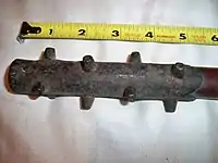 A close-up of the iron studs on an antique Japanese ararebō, a small version of the kanabō.