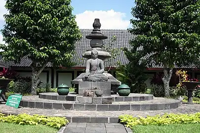 The Unfinished Buddha from the main stupa of Borobudur at Karmawibhangga Museum. On its back is chhatra (three-tiered parasol) which was dismantled from the top of Borobudur's main stupa because of frequent lightning stroke.