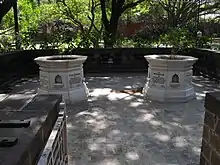 Kasturba Gandhi Memorial Stone (One on the right) with the memorial stone of Mahadev Desai in the palace where she died.