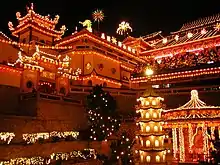 Temple at night illuminated with light from decorations