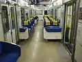 The interior of end car 815 with transverse seating in July 2014