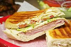 Image 3A Cuban sandwich is a variation of a ham and cheese sandwich that originated among the Cuban workers in the cigar factories in Key West, Florida