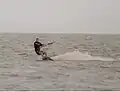 Kiteboarder edging his board