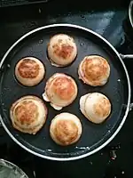 Kuḻi paniyaram being prepared