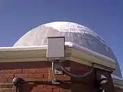 Night sky camera mounted on the roof of an observatory