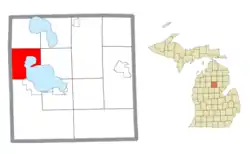 Location within Roscommon County (red) and an administered portion of the Houghton Lake CDP (pink)