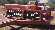 "Dixon land imprinter with seeder"