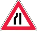 Road narrows on left side