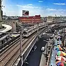 A two-car 1000 class train approaching EDSA station