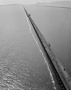 Aerial view of the Lucin Cutoff trestle before removal. The 1950s causeway can be seen to the right of the trestle.