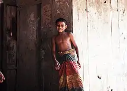 Bangladeshi boy in a traditional lungi.