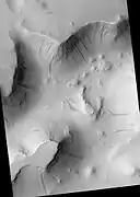 Lycus Sulci, as seen by HiRISE.  Click on image for a better view of Dark Slope Streaks.