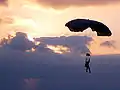 A Marine Raider glides towards his target during high-altitude parachute operations.