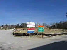 A construction site with several colorful signs