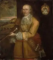 Painting of a balding man with grey hair. The man is wearing a highly decorated coat, and he is holding a staff of sorts.