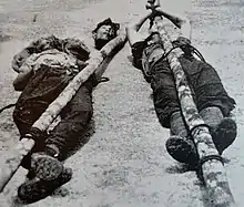 Two corpses and a severed head belonging to guerrillas killed by the Queen's Own Royal West Kent Regiment.