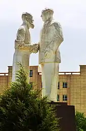 Statue of Kurban Tulum and Mao Zedong in downtown Keriya.