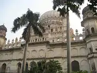 The main entrance way of Maqbara is lined with palm trees.