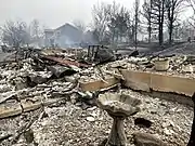 Front porch of a home burned by the fire.