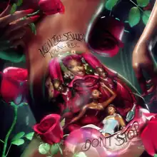 A tattoo on the buttocks presenting Megan Thee Stallion in three different positions and fashions and Young Thug in the same, wearing on the left and right sides of Megan. On the right there is also a bottle with a note saying "DRINK ME!". Over all the body, there are roses. Hands are with red nails and right hand is hiding left breast. Writings on tattoo reads: on the top, "MEGAN THEE STALLION", "YOUNG THUG" and on the bottom "DON'T STOP".