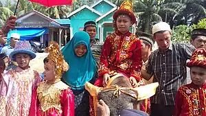 Indonesian Muslim boy wearing traditional circumcision costume