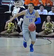 Michael Dixon is dribbling the ball for the Memphis Tigers at the NCAA Torunament in Raleigh