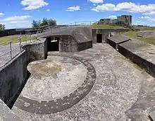 An underground power room supported by iron columns that was used to train some of Australia's first troops that were sent to Vietnam in 'Code of Conduct' courses with tigers cages pictured on the left and gun emplacements