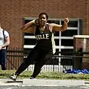 A Marauders women's shot putter during a track meet in 2021