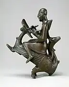 German monastic scribe astride a wyvern (mid-12th century)