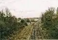 Moor Lane Goods Yard, by Brettell Lane railway station, near Stourbridge in 2004. The carriage sidings (left after the metal fencing) are now out of use and partly removed (part lifted).