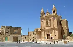 View of Munxar parish church and surroundings