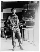 full length portrait of N.C. with his palette in his studio