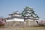 Remains of stone foundations in front of a Japanese castle.