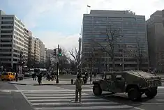 Military personnel and vehicle in the street