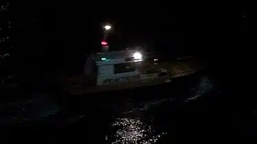 Pilot boat in Almeria, Spain, showing the white-over-red night lighting