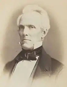 1859 sepia tone head and chest photo of Nehemiah Abbott, facing left, looking slightly left