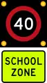 (R1-6) 40 km/h school zone speed limit in effect when flashing