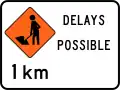 (TW-1B.2.1) Road workers ahead in 1 kilometre, delays possible