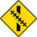 (W15-8.3/PW-60.2) Railway crossing ahead at an oblique angle