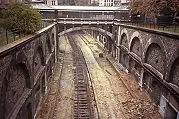 The old rails of the Auteuil line – Champ-de-Mars connection being removed in 1984 as part of the conversion to the RER C. This is at the old Boulainvilliers station.